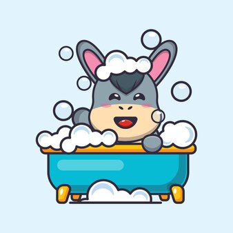 Âne mignon prenant un bain moussant dans la baignoire