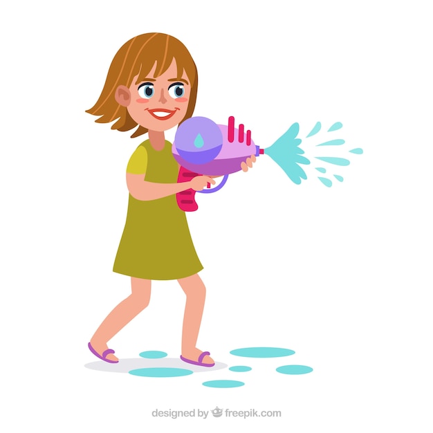 Bonne fille jouant avec un pistolet à eau