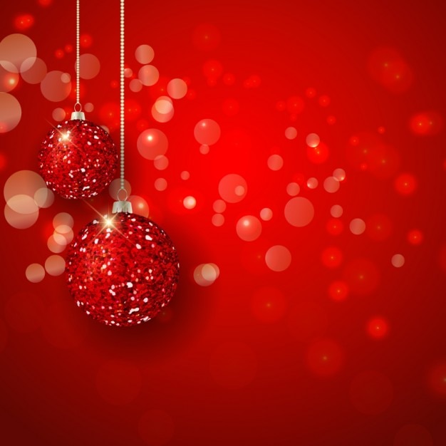 Vecteur gratuit boules de noël lumineuses sur un bokeh fond rouge