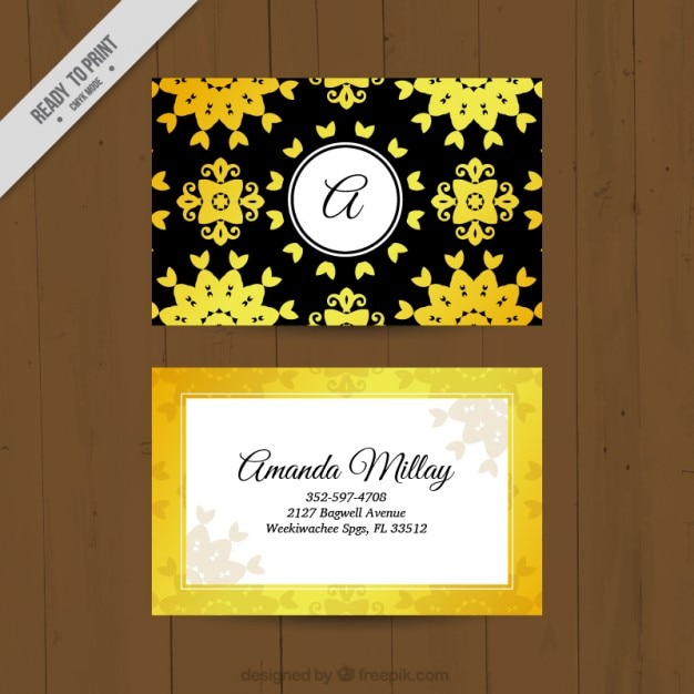 Vecteur gratuit carte corporative jaune avec des ornements floraux