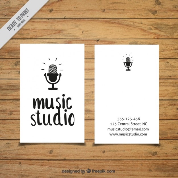 Vecteur gratuit carte avec un microphone dessiné à un studio de musique