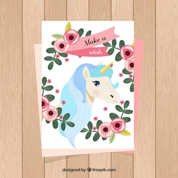 Vecteur gratuit carte mignonne avec licorne et cadre floral