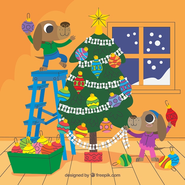 Vecteur gratuit chiens décorant un arbre de noël