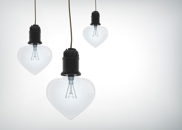 Concept de design amoureux léger avec des ampoules électriques réalistes en forme de coeur suspendu à des fils isolés