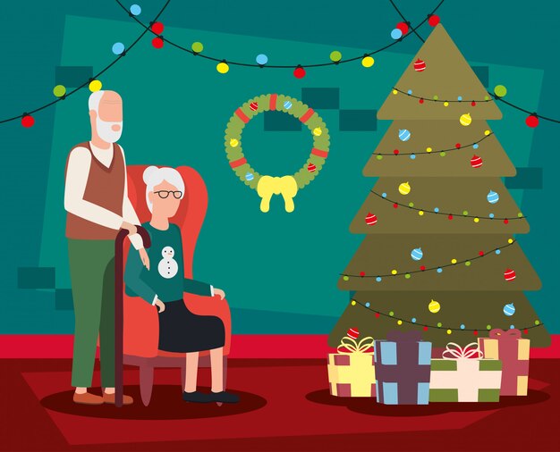 Couple de grands-parents dans la salle de séjour avec décoration de Noël