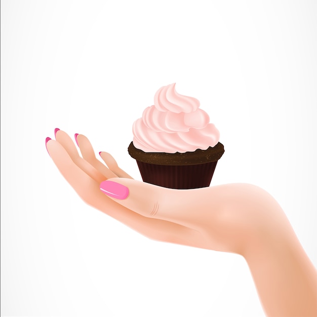 Cupcake sur la paume de la femme