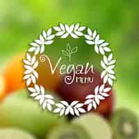 Vecteur gratuit design décoratif de menu végétalien avec l'image défocalisé de fruits