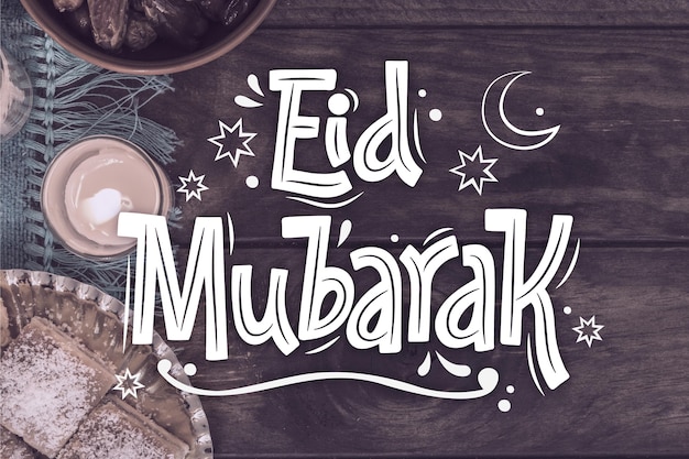 Vecteur gratuit eid al-fitr dessiné à la main - lettrage eid mubarak