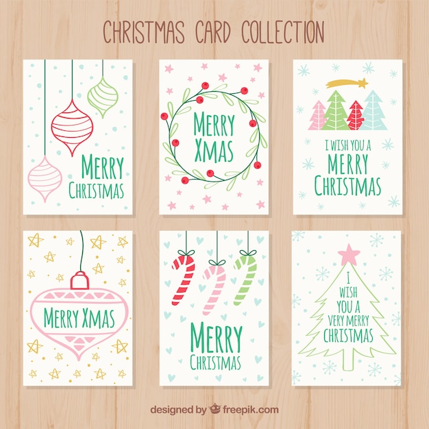 Vecteur gratuit ensemble de cartes de noël dessinées à la main