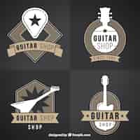 Vecteur gratuit ensemble de quatre logos de guitare