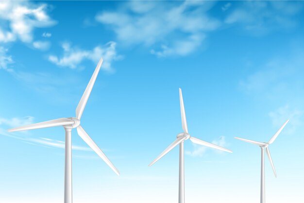 Éoliennes sur fond de ciel bleu nuageux