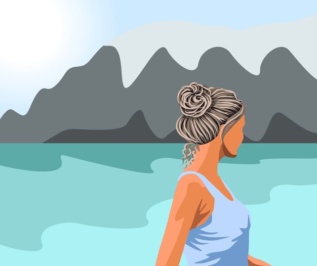 Femme aux cheveux gris en débardeur bleu regardant le lac et les montagnes