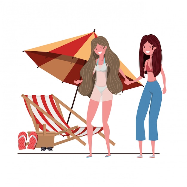 Femmes avec maillot de bain sur la plage et parasol