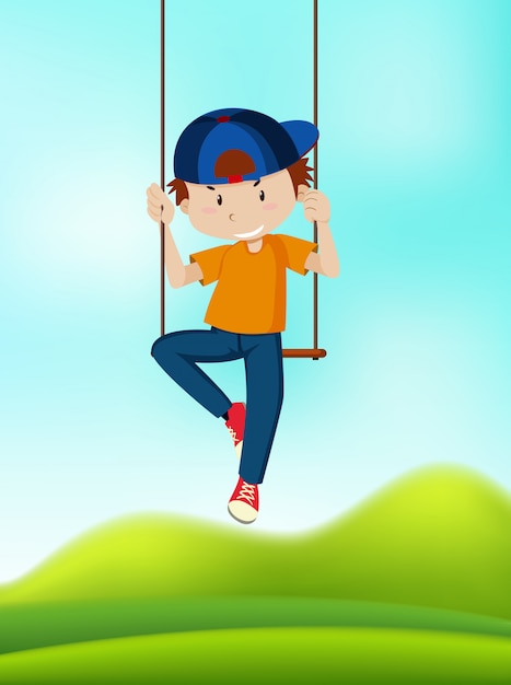 Un garçon jouant sur une balançoire