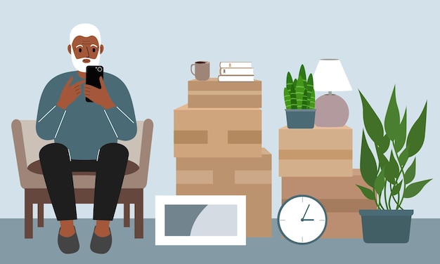 Grand-père à la maison avec un téléphone portable, le téléphone est assis sur une chaise. le concept d'enregistrement en ligne de livraison de cartons, de marchandises et d'aide au déménagement.