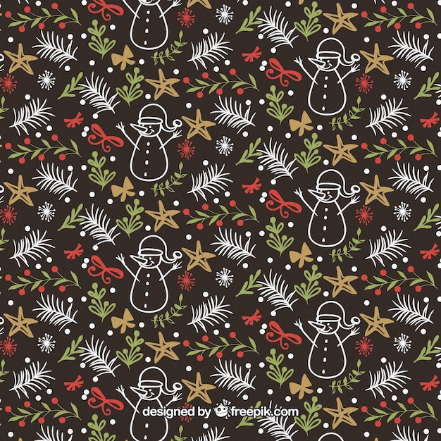 Vecteur gratuit hand drawn christmas pattern avec des feuilles et des bonhommes de neige