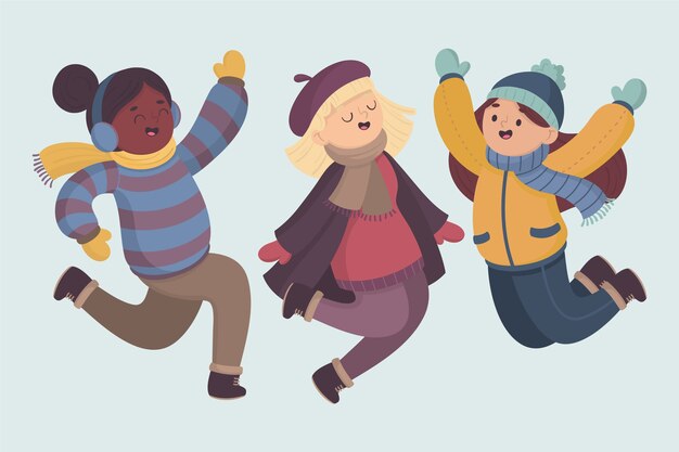Jeunes portant des vêtements d'hiver sautant