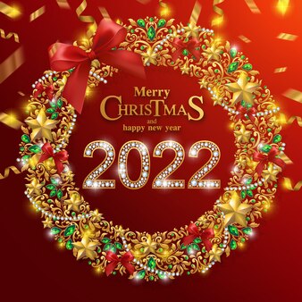Joyeux noël et bonne année 2022 avec motifs dorés et cristaux sur papier couleur.