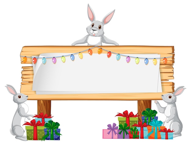 Vecteur gratuit lapins célébrant avec des coffrets cadeaux et une pancarte