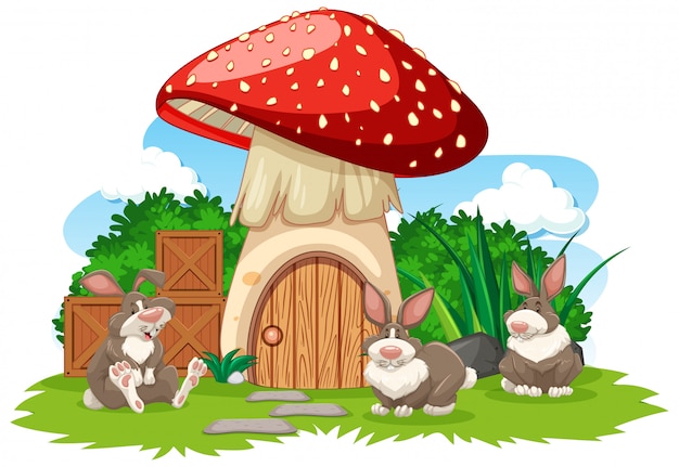 Vecteur gratuit maison aux champignons avec trois style de bande dessinée de lapin sur fond blanc