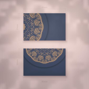 Modèle de carte de visite de couleur bleue avec ornement de mandala marron pour votre marque.