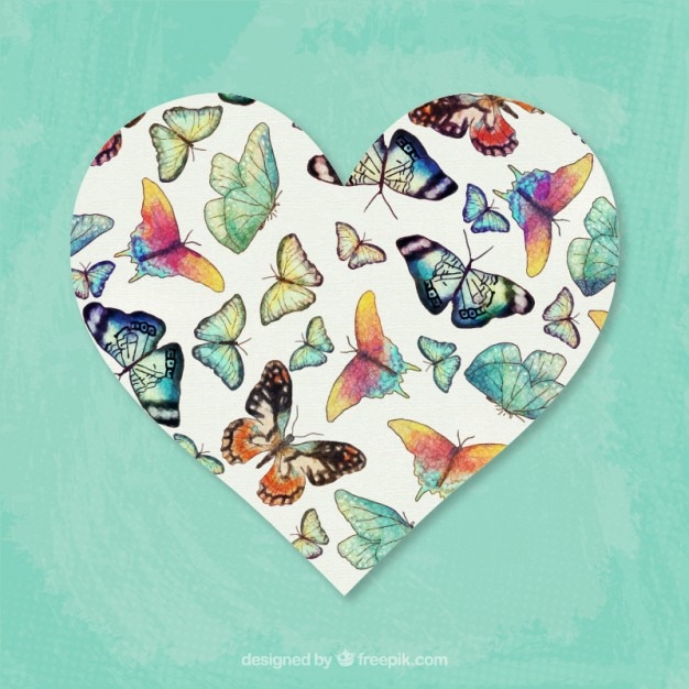 Vecteur gratuit papillons dessinés à la main à l'intérieur de coeur