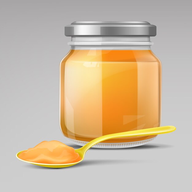 Pot en verre pour bébé et cuillère en plastique avec purée