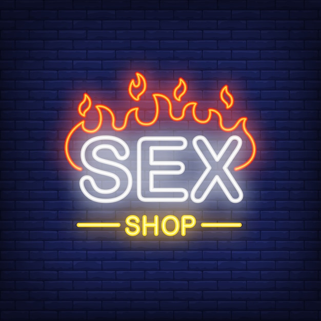 Vecteur gratuit sex shop lettrage en feu. néon sur fond de brique.