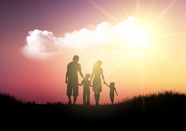 Silhouette d&#39;une famille marchant contre un ciel coucher de soleil