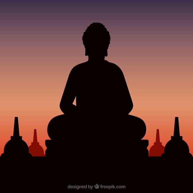 Statue de la silhouette de Bouddha avec coucher de soleil