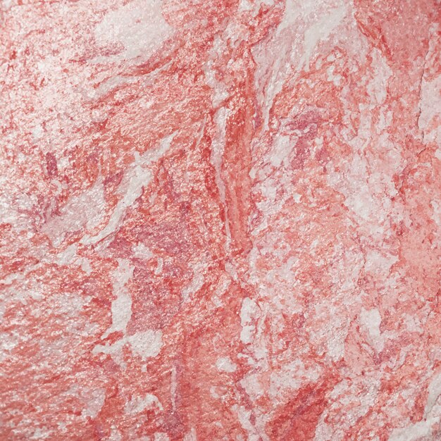 Texture de mur rose grossièrement peinte