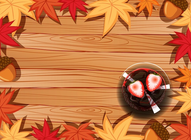 Vue de dessus de la table en bois avec élément de dessert et de feuilles d'automne