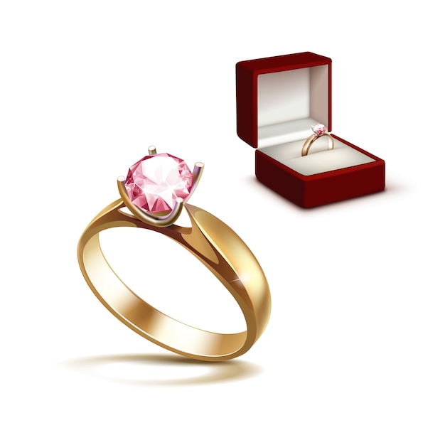 Bague de fiançailles en or avec diamant clair brillant rose dans une boîte à bijoux rouge Close up isolé sur fond blanc