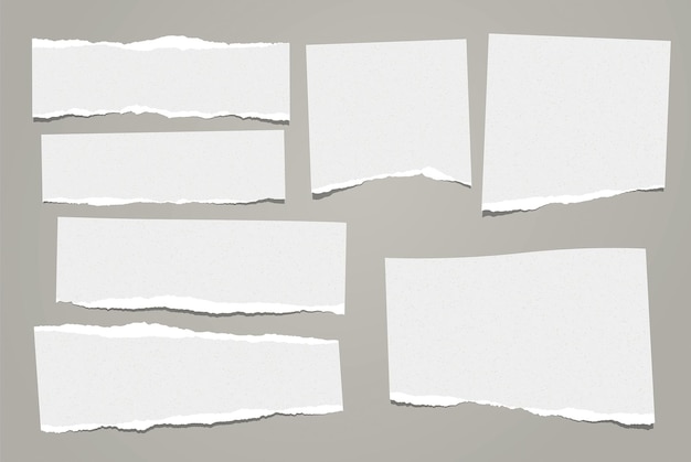 Et des bandes de papier déchirées collées sur du papier gris déchiré