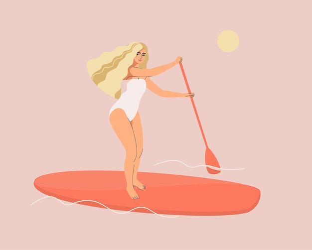 Belle femme blonde en maillot de bain sur une planche de SUP