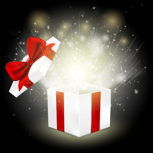 Boîte cadeau ouverte avec un nœud rouge et des lumières