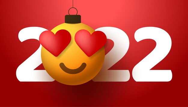 Bonne année 2022 avec émotion de sourire de coeur. Illustration vectorielle dans un style plat avec le numéro 2022 et émotion de coeur d'amour dans la boule de Noël accrochée au fil.