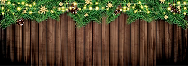 Branches de sapin avec néons sur fond de bois Décoration de Noël avec étoiles dorées