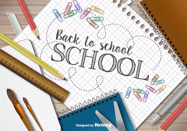 un cahier avec les mots de retour à l'école écrits dessus