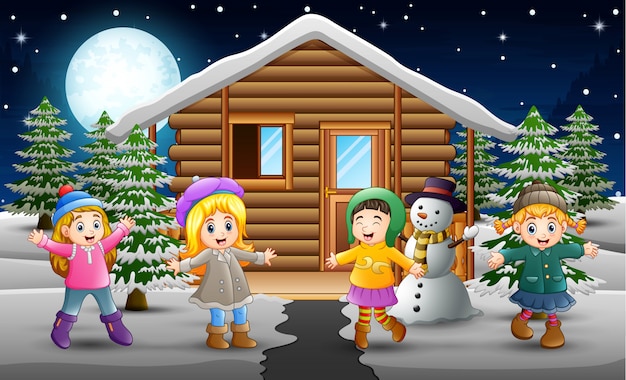 Caricature D'enfants Heureux Portant Des Vêtements D'hiver Devant Le Village Enneigé