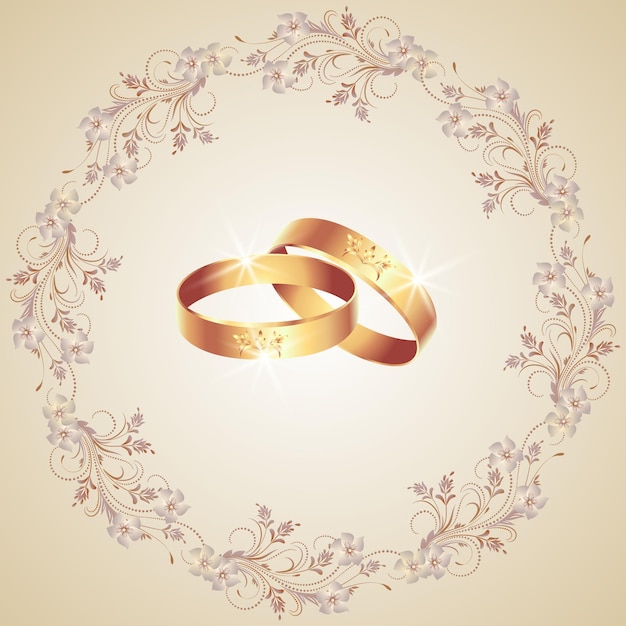Carte avec anneaux de mariage et cadre d'ornement floral