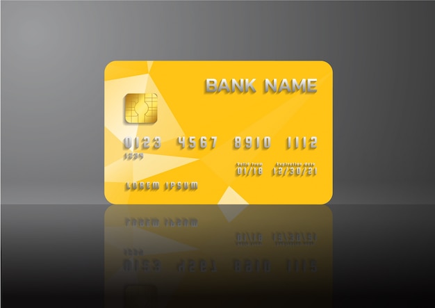 Carte de crédit jaune sur fond gris avec une ombre