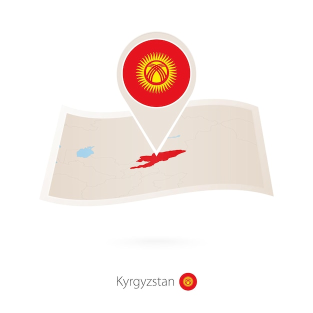 Carte papier pliée du Kirghizistan avec épinglette du drapeau du Kirghizistan