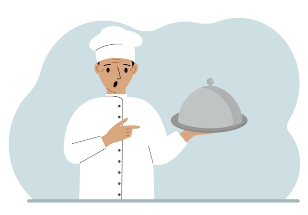 Un chef masculin avec une assiette recouverte d'une cloche ou un plateau avec un couvercle