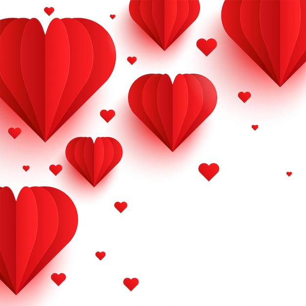 Coeurs de papier rouge sur fond blanc. Concept de l'amour