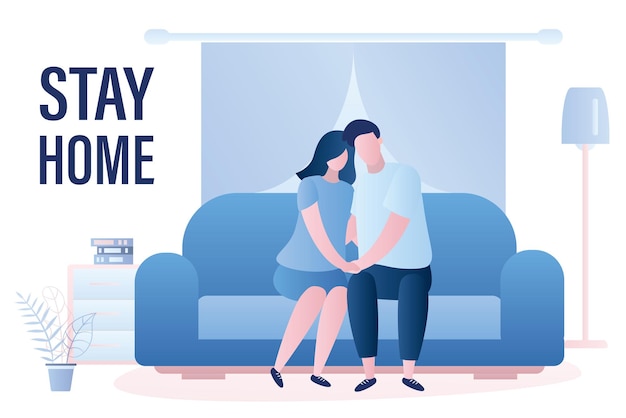 Le couple d'amour est assis sur le canapé la famille dans l'intérieur du salon