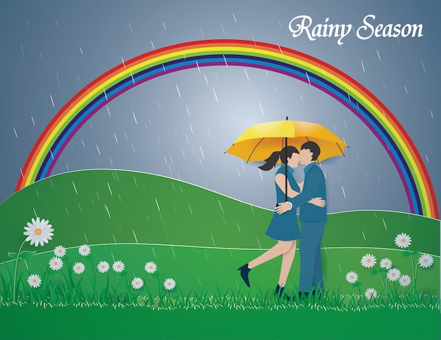 Couple Debout Sur L'herbe Verte Et L'arc-en-ciel