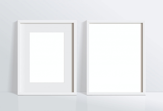 Définir une image de cadre blanc vertical vide minimale accrochée au mur blanc. isoler l'illustration.