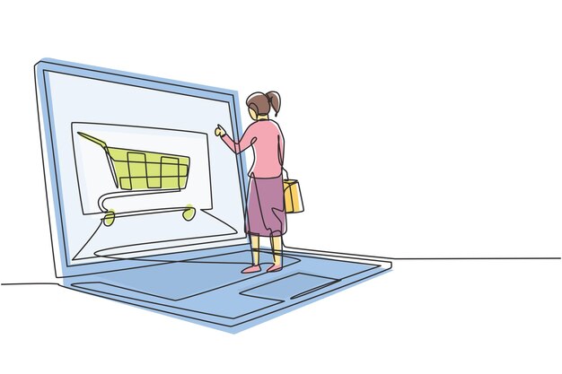 Vecteur dessin d'une ligne continue de jeunes femmes faisant du shopping en ligne via un écran d'ordinateur portable géant style de vie numérique