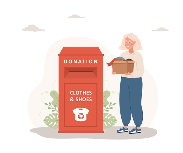 Don De Vêtements Une Femme âgée Avec Une Boîte En Carton Donne Des Choses à Recycler Ou à Donner
